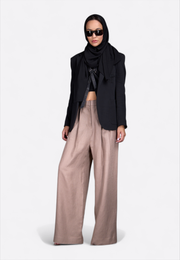 Model wearing classic black linen blazer, front-side view – East Vibe